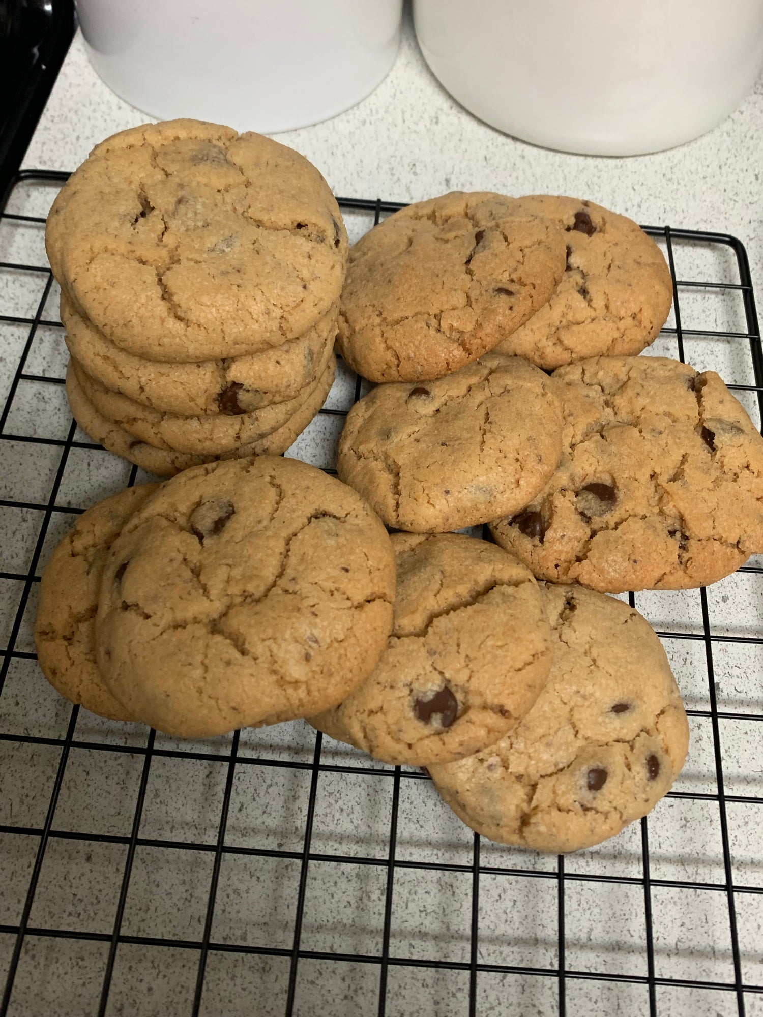 Cookies on a cooling rack with a white surface in the background